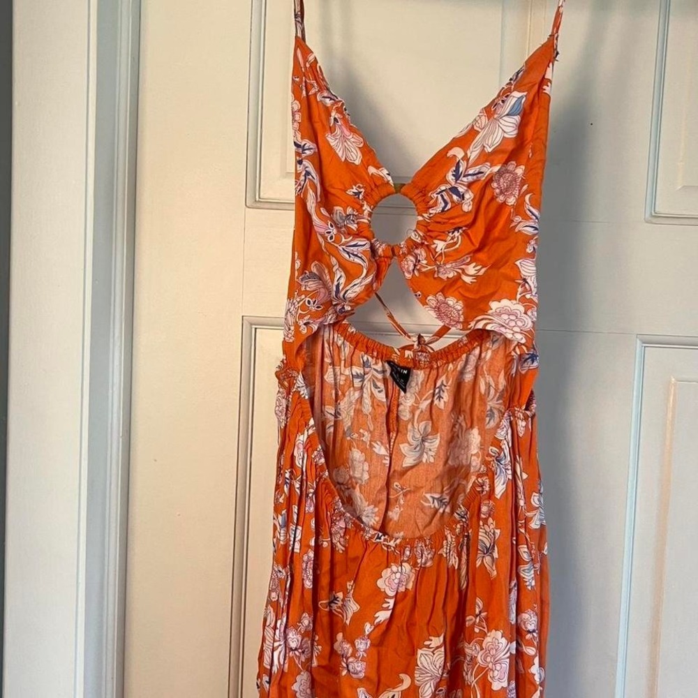 Orange floral maxi dress with cutout back and tie detail